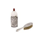 A LATE QAJAR SILVER BRUSH AND GLASS BOTTLE