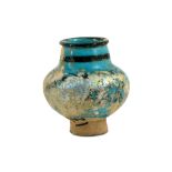 A SMALL BLACK-PAINTED TURQUOISE-GLAZED JAR