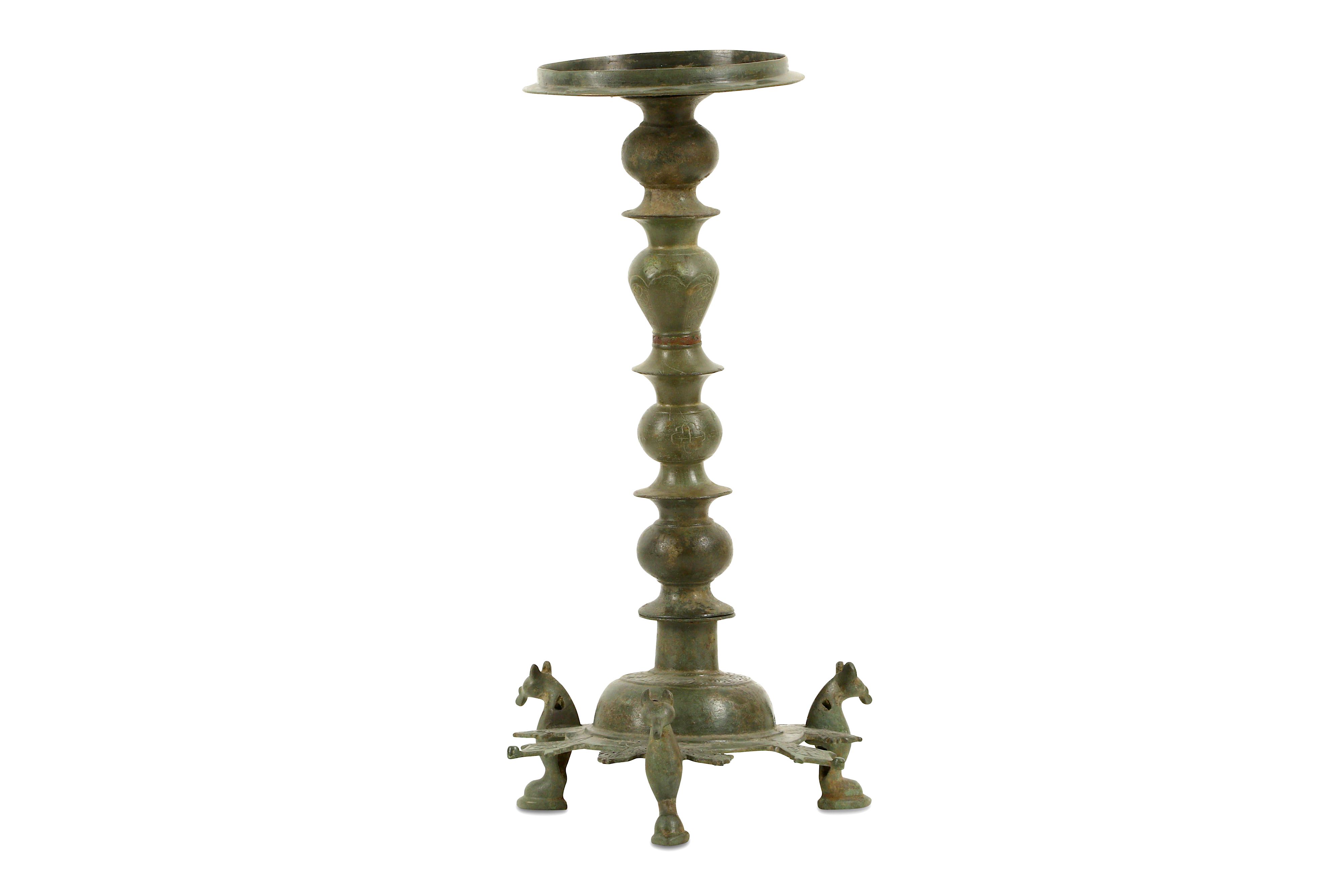 A BRONZE THREE-FOOTED OIL LAMP STAND