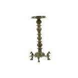 A BRONZE THREE-FOOTED OIL LAMP STAND