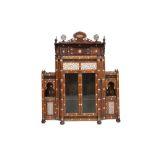 A MOTHER-OF-PEARL-INLAID WOODEN CUPBOARD