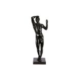 A contemporary bronze sculpture of naked man in standing position