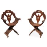 A pair of mother-of-pearl-inlaid wooden folding chairs