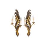 A pair of early 20th Century carved and parcel gilt wall sconces