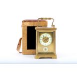 An antique brass four glass brass alarm carriage clock