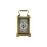A late 19th century French brass and porcelain mounted carriage clock