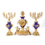 A 19th century style gilt brass and blue porcelain urn shaped mantel clock garniture