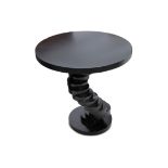 A contemporary ebonised circular side table