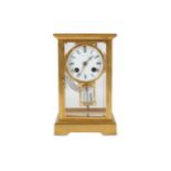 A late 19th century French gilt brass four glass mantel clock retailed by Tiffany & Co. New York