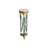 A Regency style green painted and gilt torchere stand
