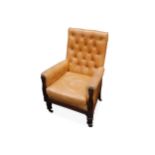 A Regency mahogany armchair, upholstered in buttoned tan leather