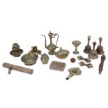 A collection of bronze and copper alloy items, including three Tibetan ritual bells