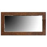 A large modern wall mirror in the manner of Andrew Martin