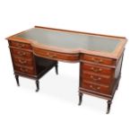 An Edwardian mahogany bow fronted writing desk