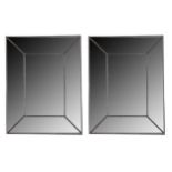A large pair of contemporary rectangular wall mirrors
