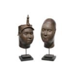 After the antique, a pair of decorative Ife bronze heads