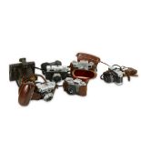 A Group of Cameras and Lenses