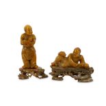 Two Chinese soapstone figures with stands.