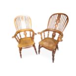 A near pair of mid 19th Century Yorkshire Broadarm Windsor armchairs in elm and yew wood