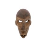 AN AFRICAN WOOD MASK