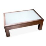 A contemporary rectangular chromed metal lightbox coffee table