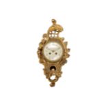 An early 20th century Swedish Rococo style giltwood cartel clock