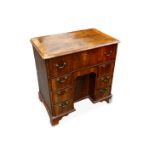 A Georgian walnut kneehole desk
