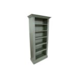 A late 20th century green painted pine open bookcase