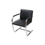 A contemporary chromed steel cantilever chair