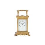 A late 19th / early 20th century French gilt brass carriage clock signed 'Goldsmiths & Silversmiths