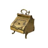 A Victorian style brass coal scuttle