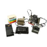 A Group of Polaroid Cameras and Accessories
