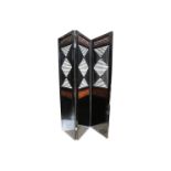 A large Oriental inspired black lacquered three fold room divider