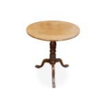 A 19th century mahogany circular tilt top table
