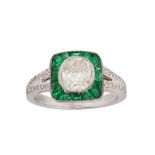 A diamond and emerald ring