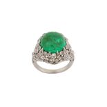 An emerald and diamond dress ring