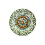 AN IZNIK POTTERY DISH WITH FLORAL DESIGN