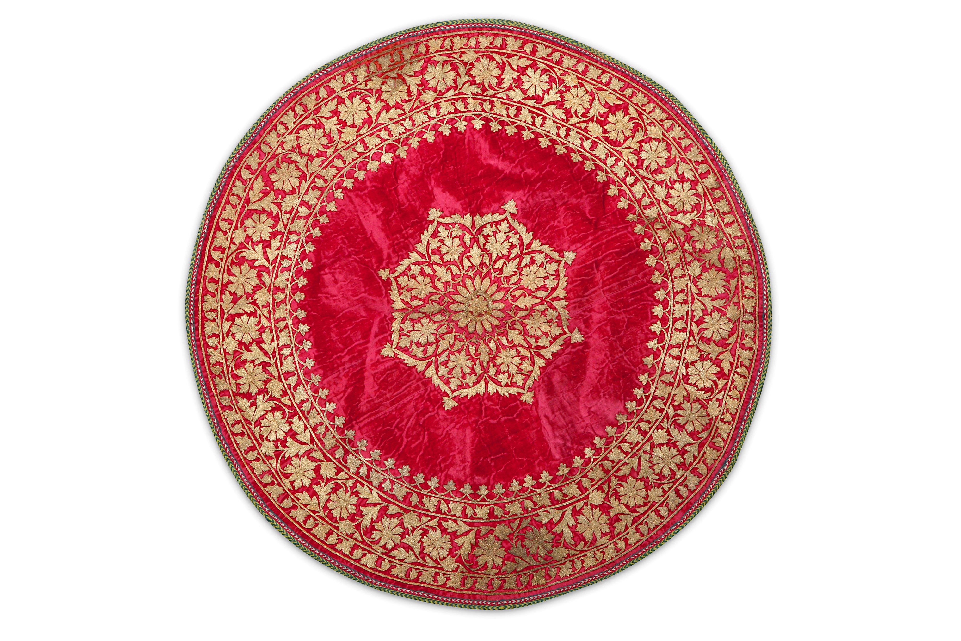 A CIRCULAR EMBROIDERED VELVET PANEL