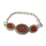 *A CARNELIAN-ENCRUSTED SILVER BAZUBAND