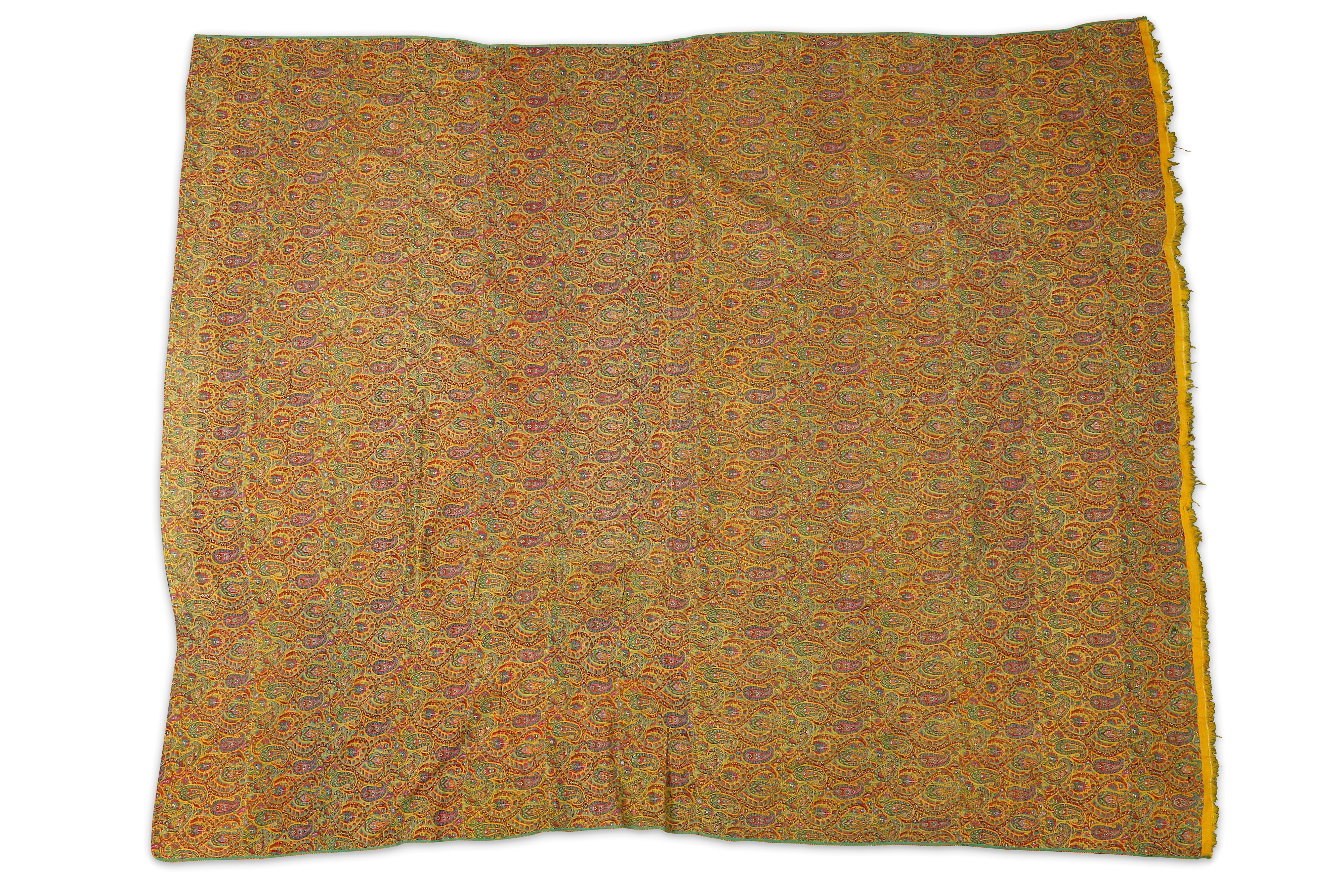 A LENGTH OF YELLOW TERMEH SHAWL CLOTH