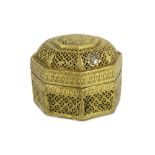 AN OCTAGONAL GILT-BRASS LIDDED SPICE BOX (PANDAN)