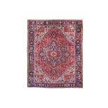 AN ANTIQUE HERIZ CARPET, NORTH-WEST PERSIA