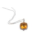 A citrine and diamond pendant necklace