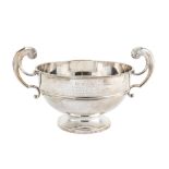 An Edwardian sterling silver twin handled trophy, Sheffield 1909 by Walker and Hall