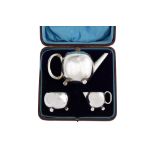 A cased Victorian sterling silver bachelor tea set, London 1895 by William Richard Corke