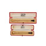 Two cased Elizabeth II 9 carat gold cigarette holders, Birmingham 1963 and 1953 by Cohen & Charles