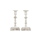 A matched pair of George II sterling silver candlesticks, London 1754 by John Cafe and London 1757 b