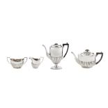 A matched Edwardian sterling silver four-piece tea and coffee service, Birmingham 1904/05 by William