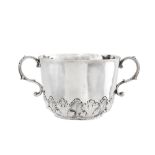 A Charles II sterling silver twin handled porringer, London 1676 by A.H, mullet above, mullet below