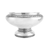 A large George V sterling silver ‘arts and crafts’ punch or fruit bowl, Birmingham 1913 by Liberty &